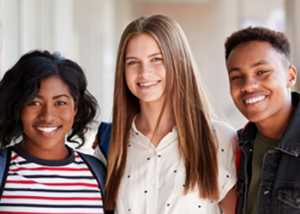 Teenaged employees smiling together