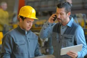 safety inspectors viewing reports on mobile